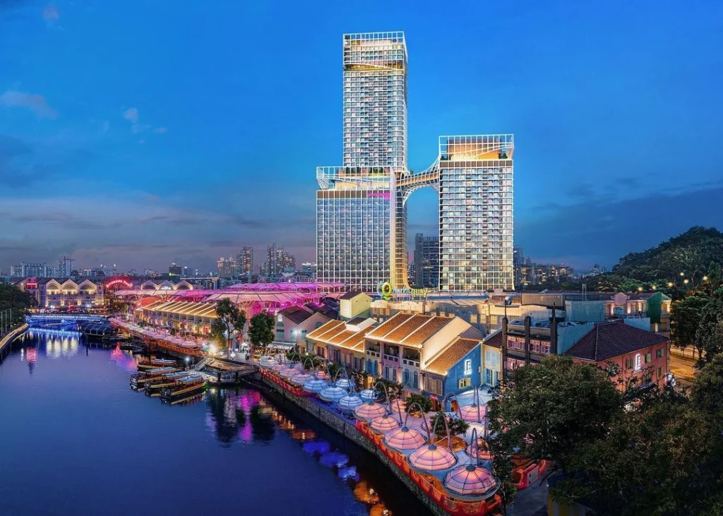 CanningHill Piers integrated condo above Clarke Quay, Singapore River – luxury residential with vibrant nightlife and city skyline at blue hour.