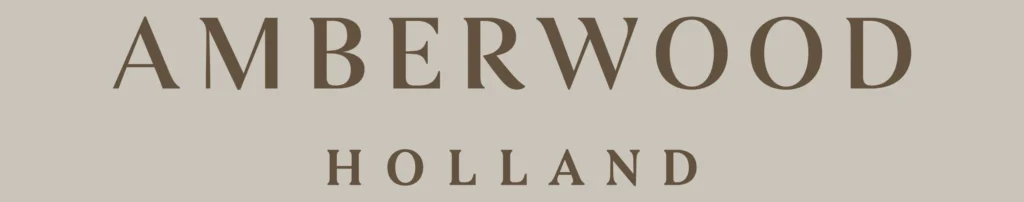Amberwood at Holland official wordmark logo in brown on a warm neutral background